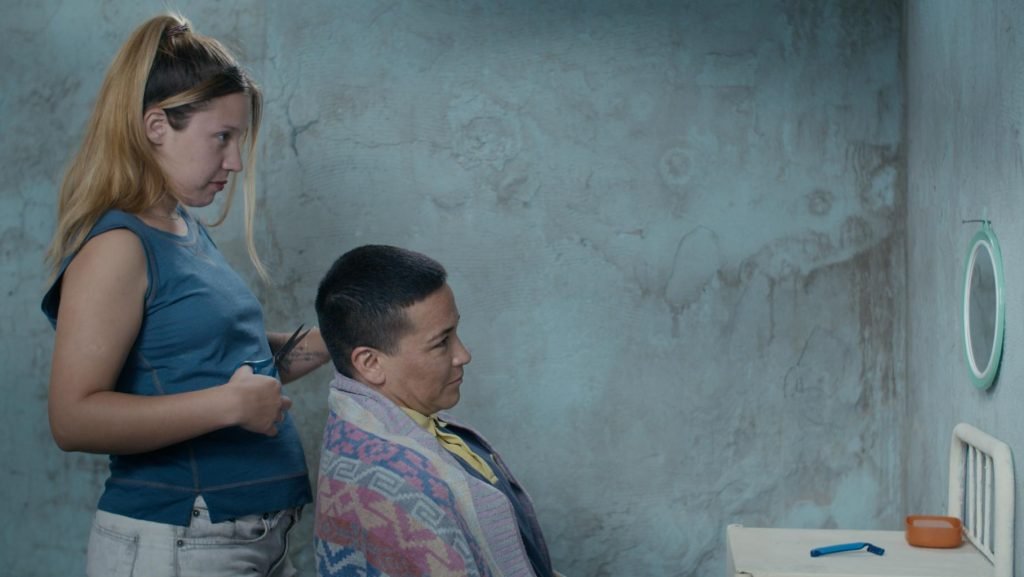 Yoceli Arias (standing) and Nacho Rodriguez (seated) in Lola Arias' 'Reas'.